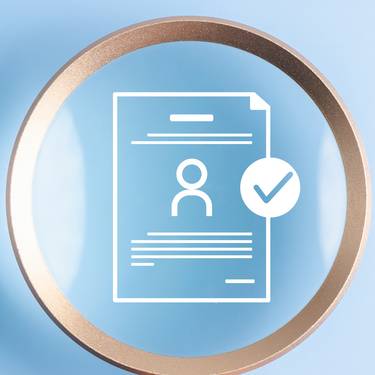 Human resources recruitment and hiring the right job candidate. Hand holding magnifying glass over resume document icon with checkmark for approval.