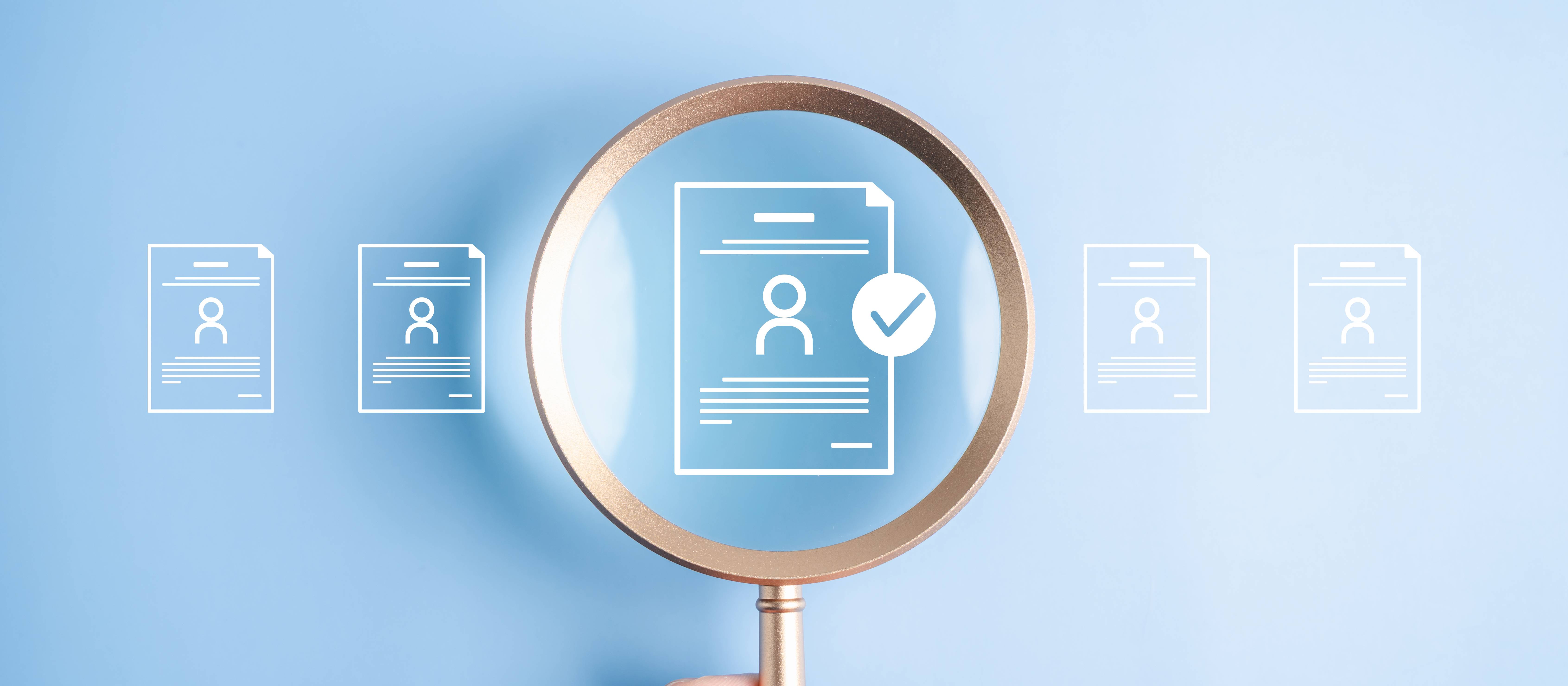 Human resources recruitment and hiring the right job candidate. Hand holding magnifying glass over resume document icon with checkmark for approval.