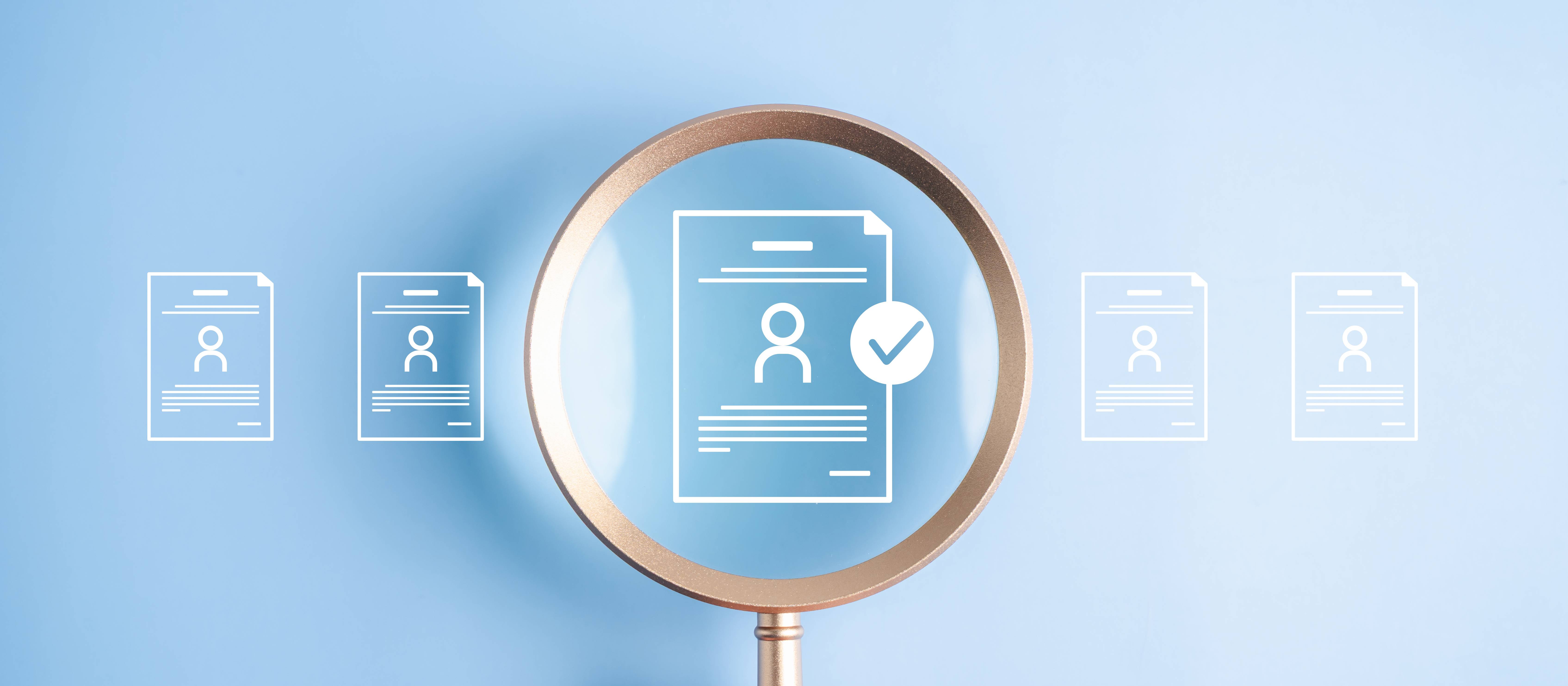 Human resources recruitment and hiring the right job candidate. Hand holding magnifying glass over resume document icon with checkmark for approval.